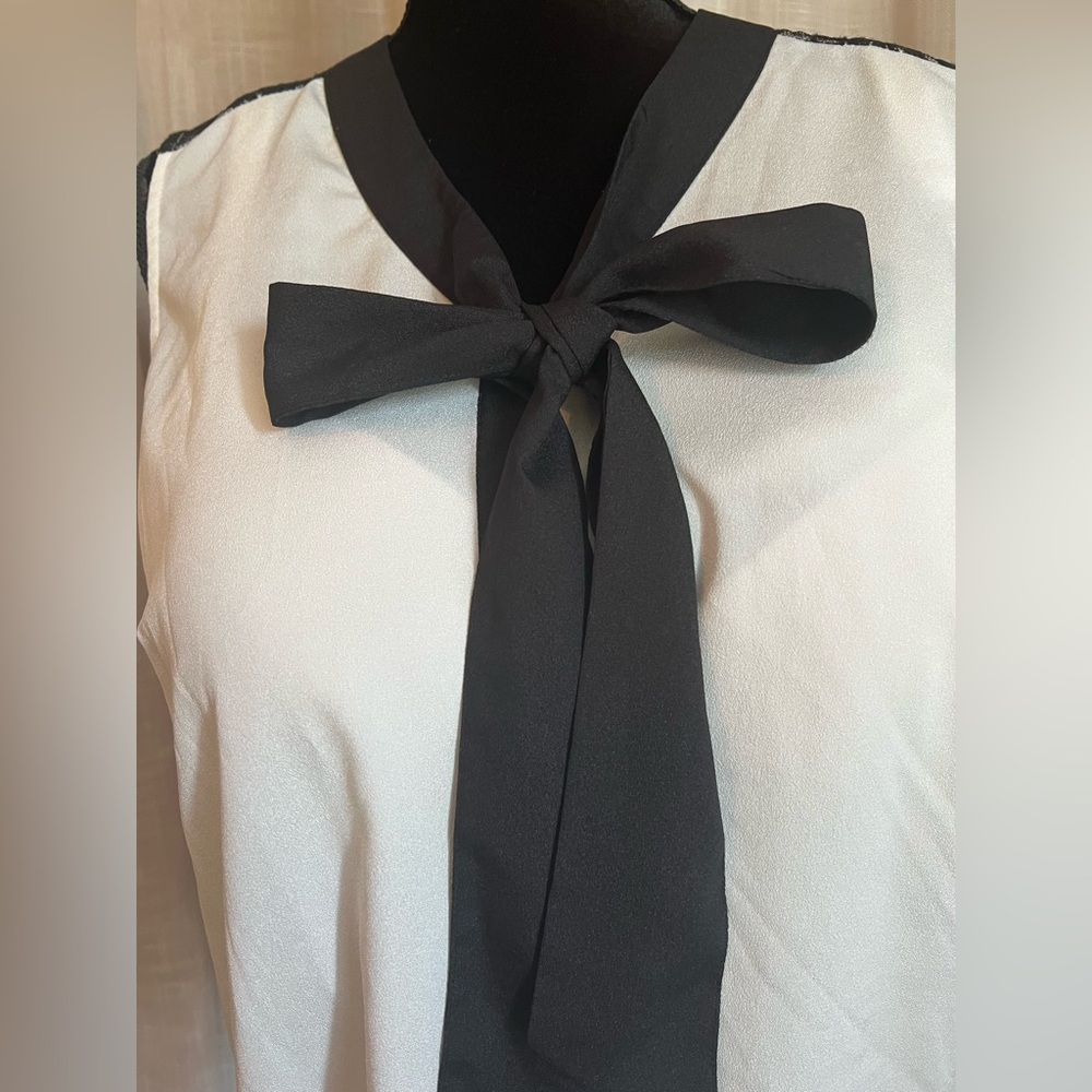 Elegant Black and White Blouse with Bow